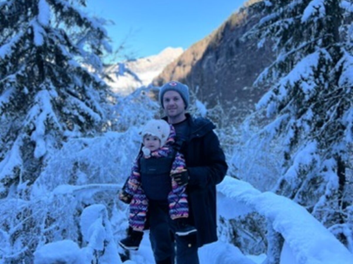 Ross and his daughter in the snowy mountains